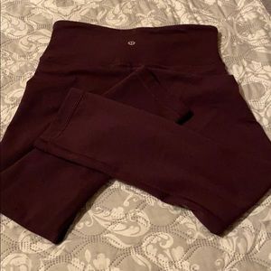 Lululemon, size 4 leggings. Dark plum, excellent.